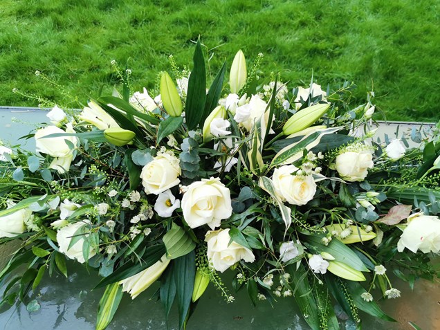 Florist choice - Whites casket spray with lillies image
